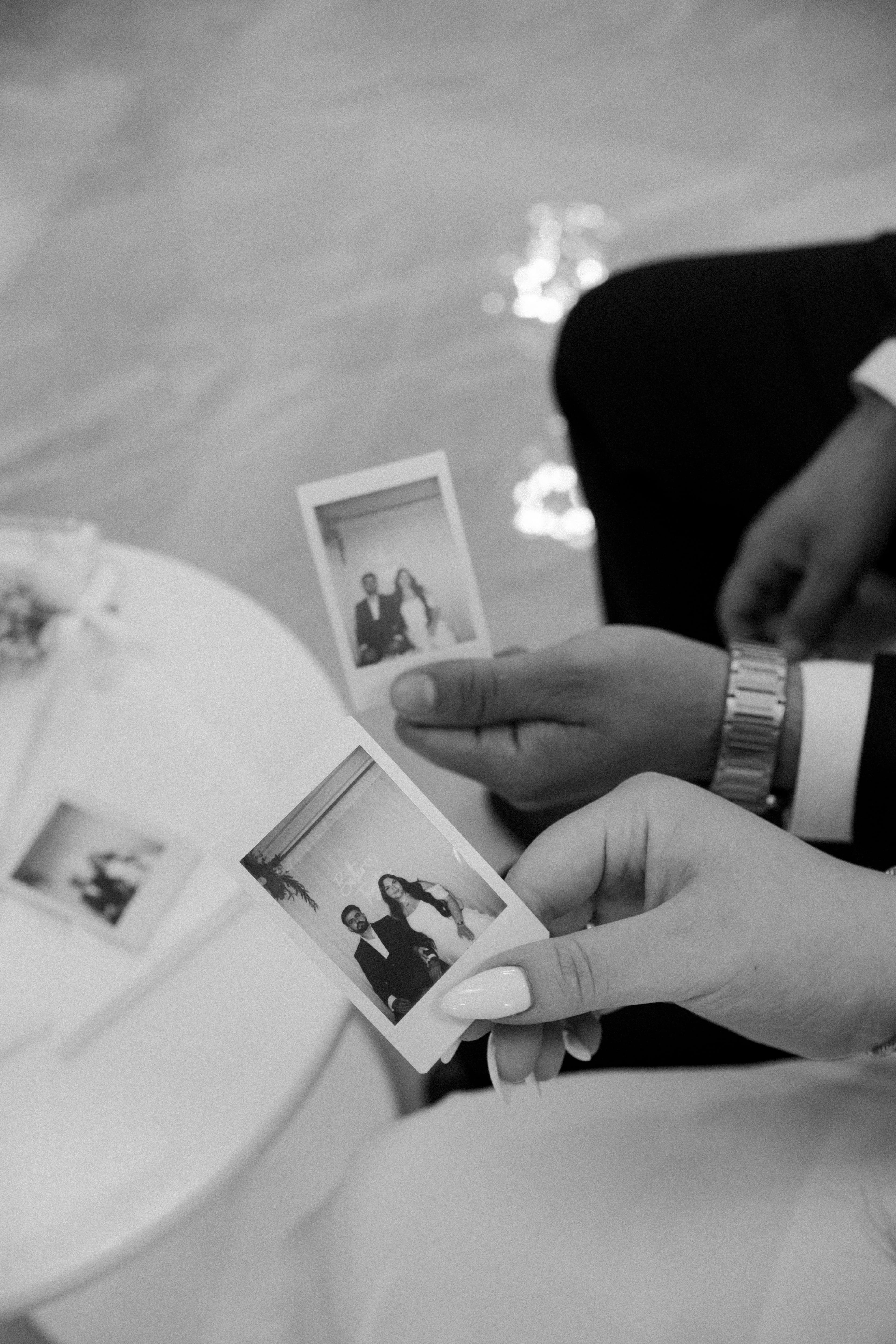 Couple looking through their wedding photos together after the wedding