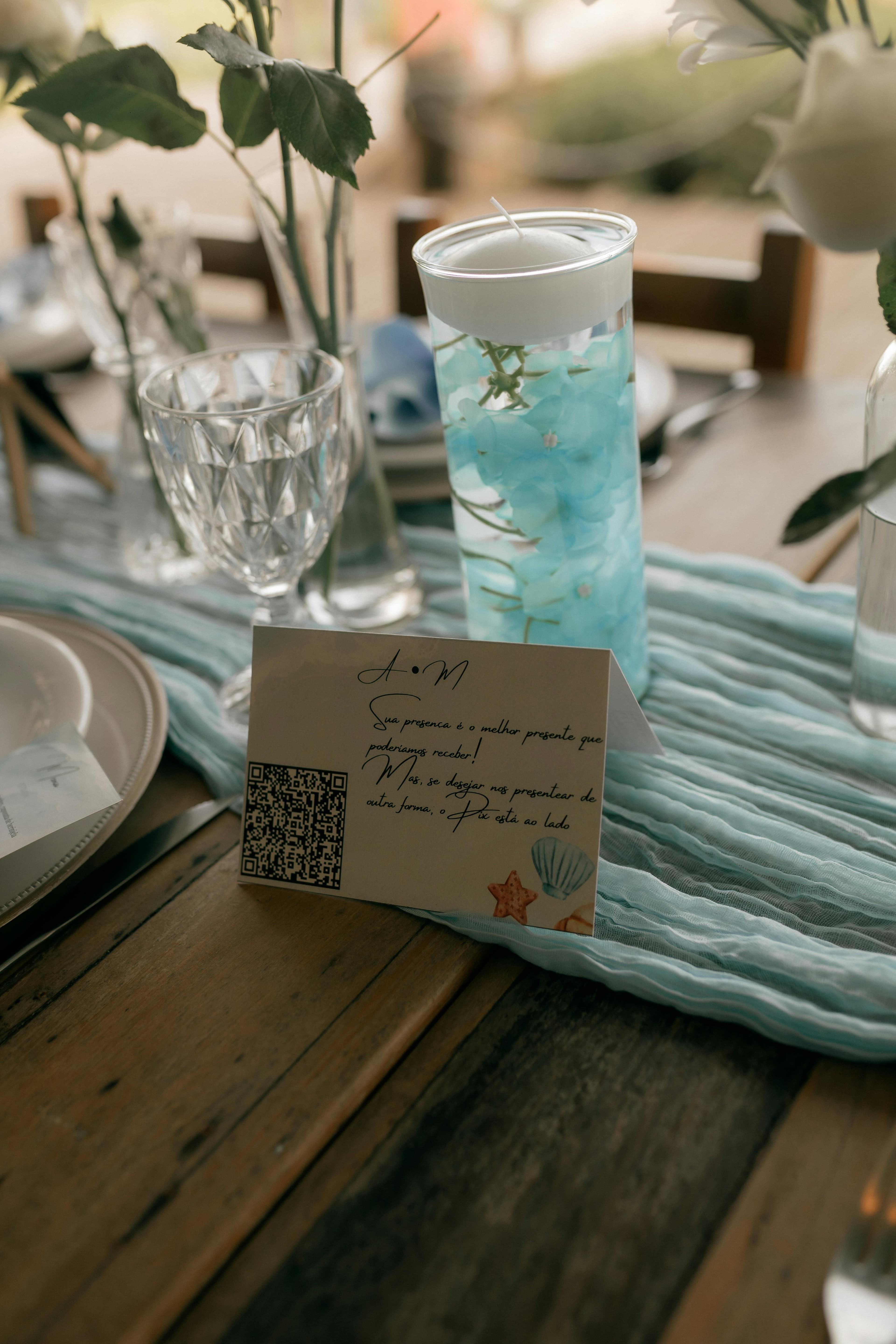 Couple reviewing a printed wedding QR code card before their reception
